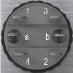 Rear view of RCI 970 illuminated exit button showing 2 SPST terminals with normally open and normally closed contact positions.