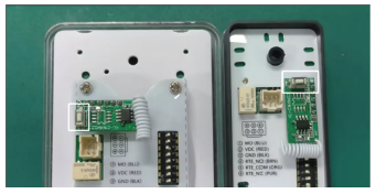 Back of the remote receiver board highlighting the pairing button and red status LED.