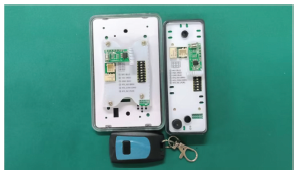 RCI remote transmitter and installed receiver shown during pairing process.